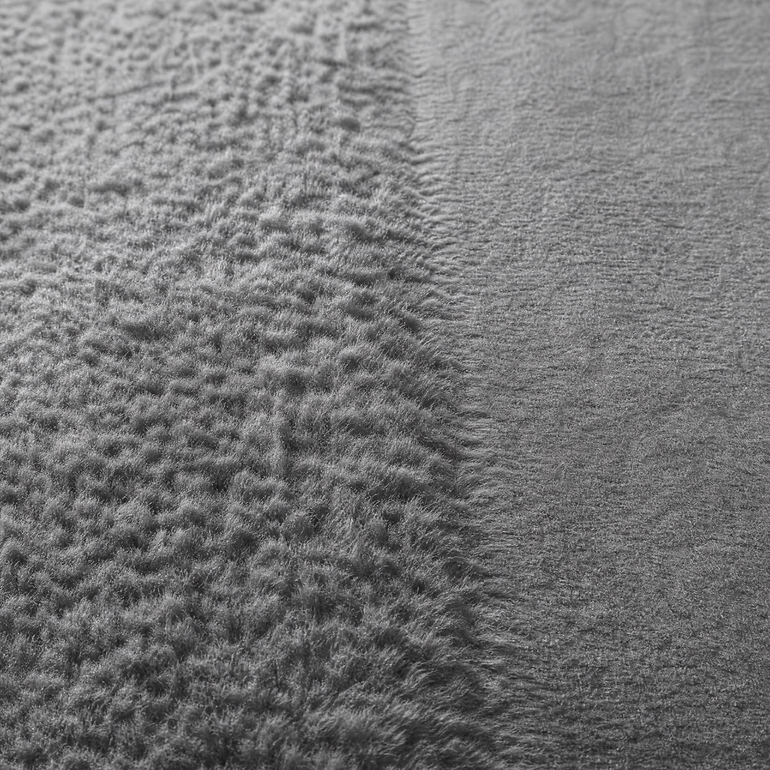 One piece of brushed fleece where the pile stands on the left half and has been pressed flat on the right half
